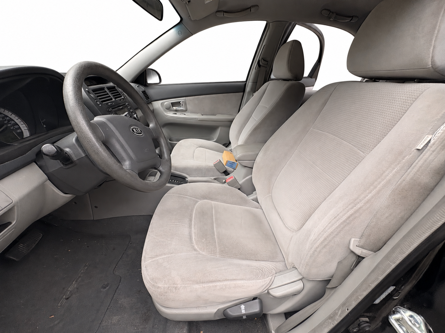 2007 Kia Spectra EX gray cloth front interior with white background
