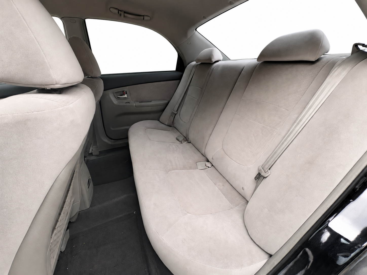 2007 Kia Spectra EX gray cloth rear seats with white background